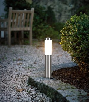 Helsinki 45cm outdoor post light in stainless steel, shown next to garden path