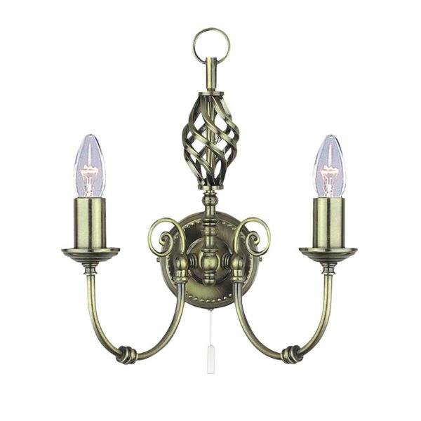 Zanzibar traditional switched twin wall light in antique brass on white background