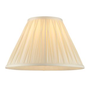 Chatsworth pinch pleat tapered 12″ ivory silk table lamp shade, on white background, lit.