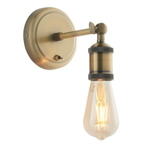 Hal single lamp switched wall light in antique brass on white background lit