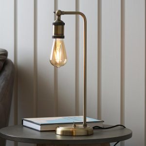 Hal 1 light industrial table lamp in antique brass on lounge table