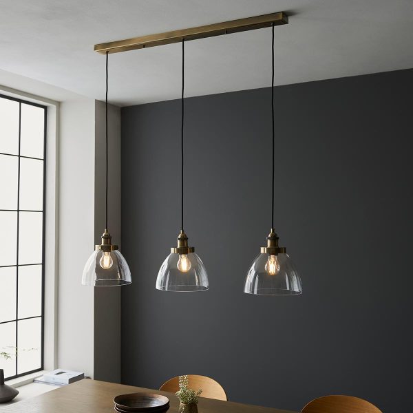 Hansen 3 light bar pendant in antique brass in dining room over table