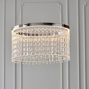 Liliana LED crystal pendant light in polished chrome in grey panelled room