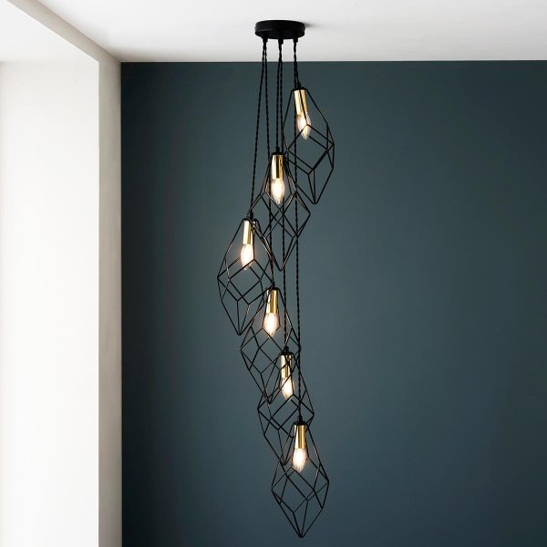 Jaxon 6 light cluster pendant in matt black and gold on room ceiling