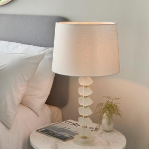 Annabelle frosted crystal table lamp in brushed gold with vintage white linen shade on bedside table