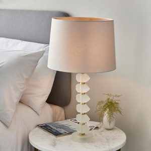 Annabelle frosted crystal table lamp in brushed gold with natural linen shade on bedside table