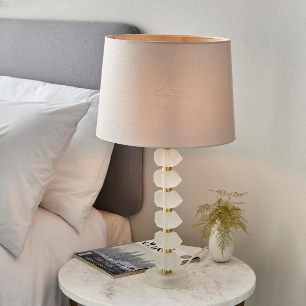 Annabelle frosted crystal table lamp in brushed gold with natural linen shade on bedside table