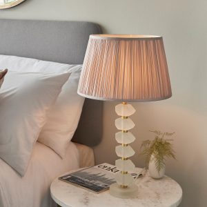 Annabelle frosted crystal table lamp in brushed gold with dusky pink silk shade on bedside table
