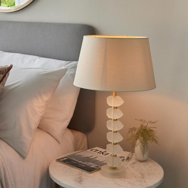 Annabelle frosted crystal table lamp in brushed gold with ivory shade on bedside table