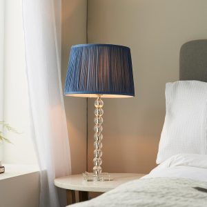 Adelie stacked clear crystal table lamp with blue silk shade on bedside table