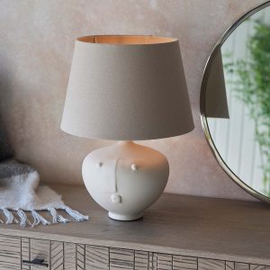 Mrs small white ceramic table lamp with grey linen mix shade on living room sideboard