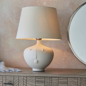 Mrs small white ceramic table lamp with ivory linen mix shade on living room sideboard