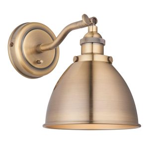 Franklin switched wall light in antique brass plate on white background
