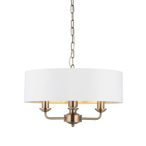 Highclere 3 light pendant in antique brass with vintage white shade on white background