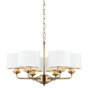 Highclere 6 light antique brass chandelier with vintage white shades on white background