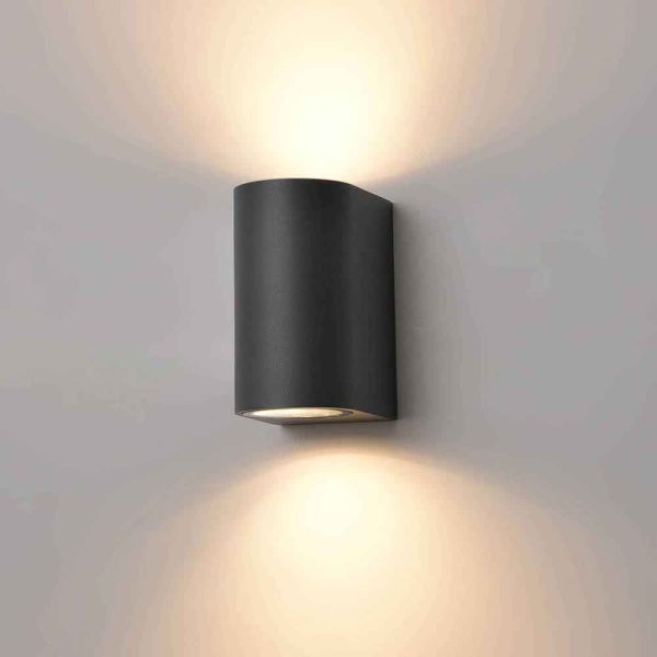 Franklite Aura 2 light outdoor wall up down spotlight in charcoal and rated IP44, shown lit on grey background.