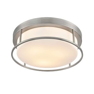 Franklite Blaine 3 light flush ceiling light in satin nickel with opal glass shade, on white background, lit.