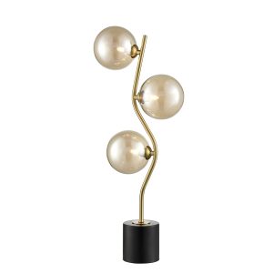 Franklite Cosmic modern 3 light table lamp in antique gold with amber glass shades on white background.