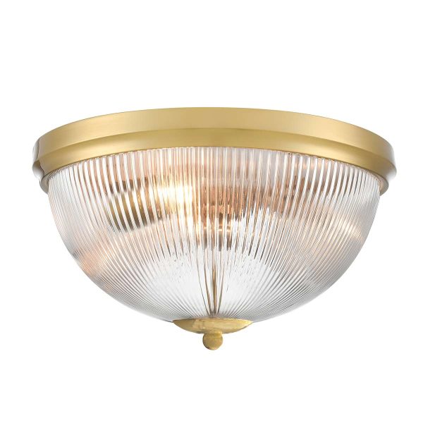Large Franklite Cupola 3 light aged brass flush ceiling light with ribbed glass shade, on white background, lit.