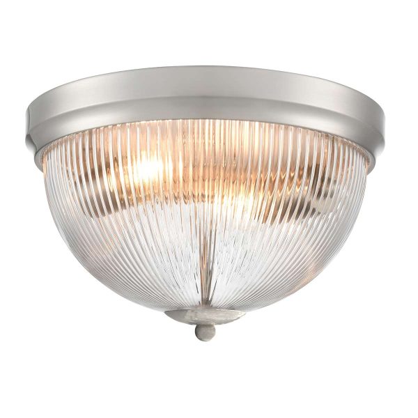 Franklite Cupola 2 light satin nickel flush ceiling light with ribbed glass shade, on white background, lit.