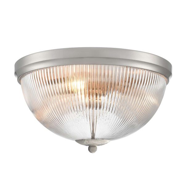 Franklite Cupola 3 light satin nickel flush ceiling light with ribbed glass shade, on white background, lit.