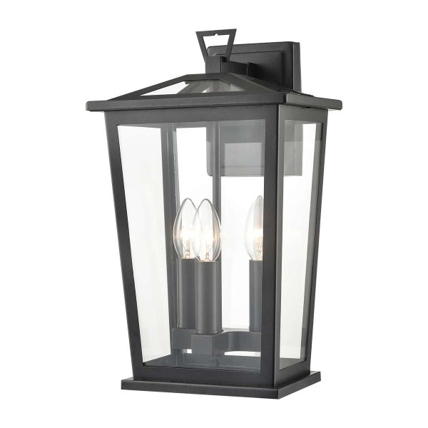 Franklite Dusk 3 light outdoor wall lantern in matt black with clear glass panels on white background.