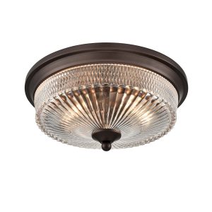 Franklite Emerson 2 light flush ceiling light in dark brown with clear ribbed glass shade, on white background, lit.