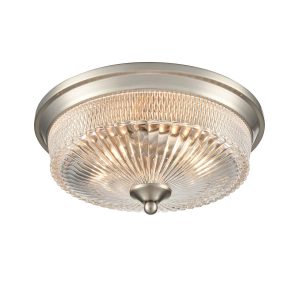 Franklite Emerson 2 light flush ceiling light in satin nickel with clear ribbed glass shade, on white background, lit.