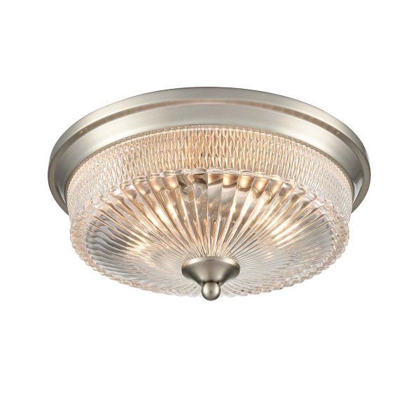 Emerson 2 light flush ceiling light in satin nickel with clear ribbed glass shade, on white background, lit.