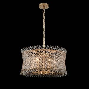 Franklite Ethereal 6 light modern chandelier in aged brass with glass rods, hung low on black background.