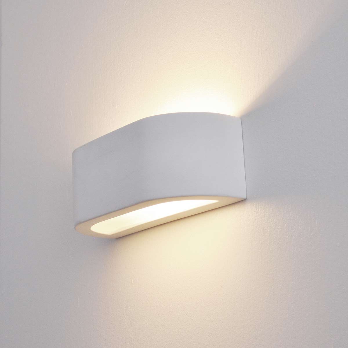 Modern paintable ceramic 1 lamp up and down wall washer light, on grey background.