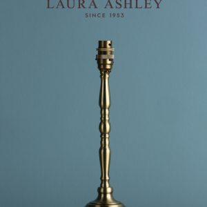 Laura Ashley Corey candlestick table lamp base only in antique brass, shown without shade as supplied.