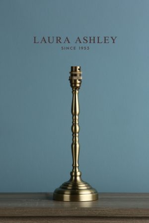Laura Ashley Corey candlestick table lamp base only in antique brass, shown without shade as supplied.