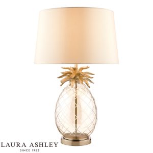Laura Ashley large Pineapple table lamp in champagne cut glass on white background, lit.