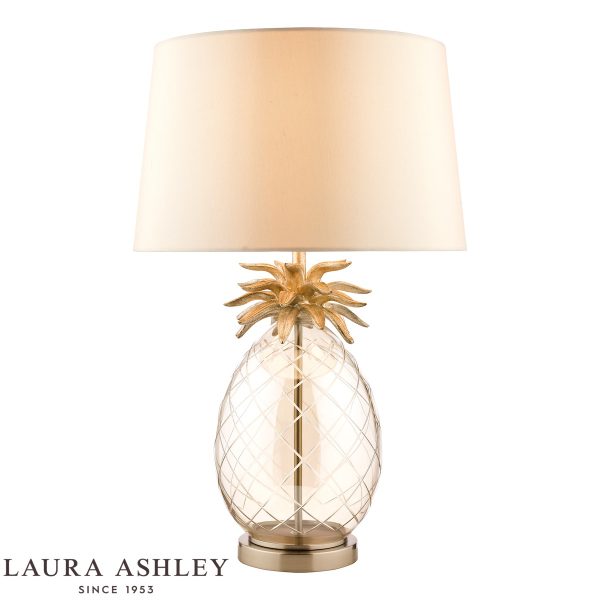 Laura Ashley large Pineapple table lamp in champagne cut glass on white background, lit.