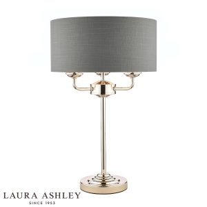 Sorrento 3 light table lamp in polished nickel with grey linen shade on white background, lit.