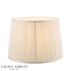 Laura Ashley Hemsley 10-inch diameter pleated cream silk drum shade, on white background, lit.