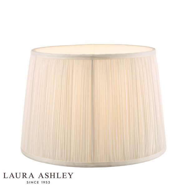 Laura Ashley Hemsley 10-inch diameter pleated cream silk drum shade, on white background, lit.