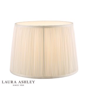 Laura Ashley Hemsley 8-inch diameter pleated cream silk drum shade, on white background, lit.