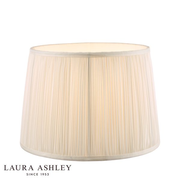 Laura Ashley Hemsley 8-inch diameter pleated cream silk drum shade, on white background, lit.