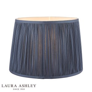 Laura Ashley Hemsley 8-inch diameter pleated blue silk drum shade, on white background, lit.
