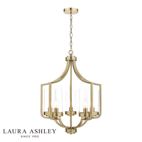 The Laura Ashley Joseph 5 light chandelier in antique brass with glass shades, on white background, lit.