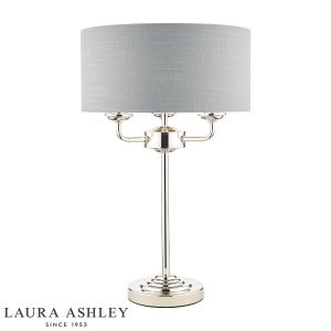 Sorrento 3 light table lamp in polished nickel with silver linen shade by Laura Ashley, on white background, lit.