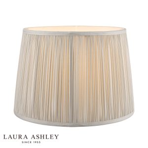Laura Ashley Hemsley 10-inch diameter pleated silver silk drum shade, on white background, lit.