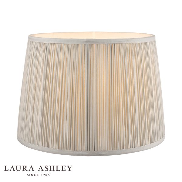 Laura Ashley Hemsley 10-inch diameter pleated silver silk drum shade, on white background, lit.