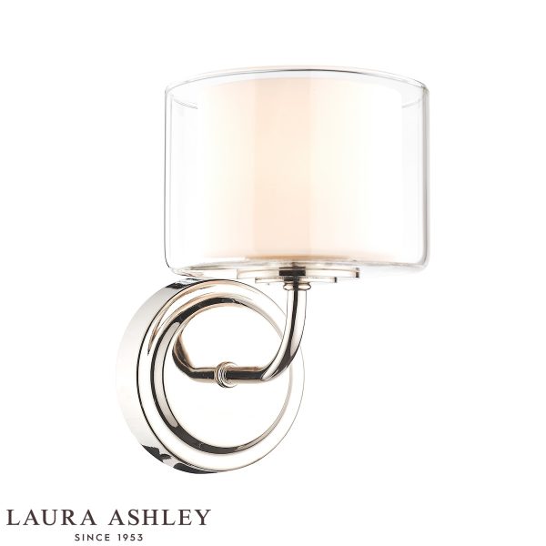 Southwell single wall light in polished nickel with glass shade by Laura Ashley, on white background, lit.