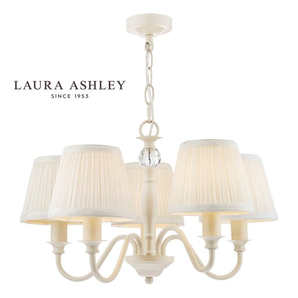 Laura Ashley Ellis 5 light chandelier in satin ivory finish with ivory shades, full height on white background, lit.
