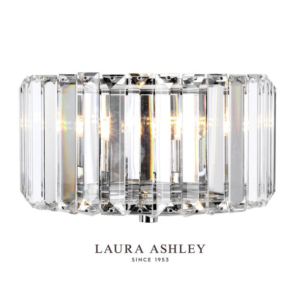 Laura Ashley Fernhurst crystal wall light with polished chrome on white background, lit.