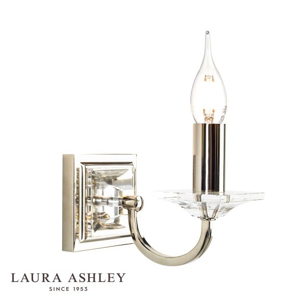 Carson single wall light in polished nickel with crystal glass, on white background, lit.