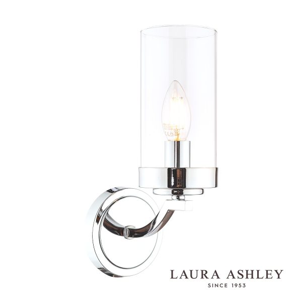 The Laura Ashley Joseph single wall light in polished chrome with glass shade, on white background, lit.